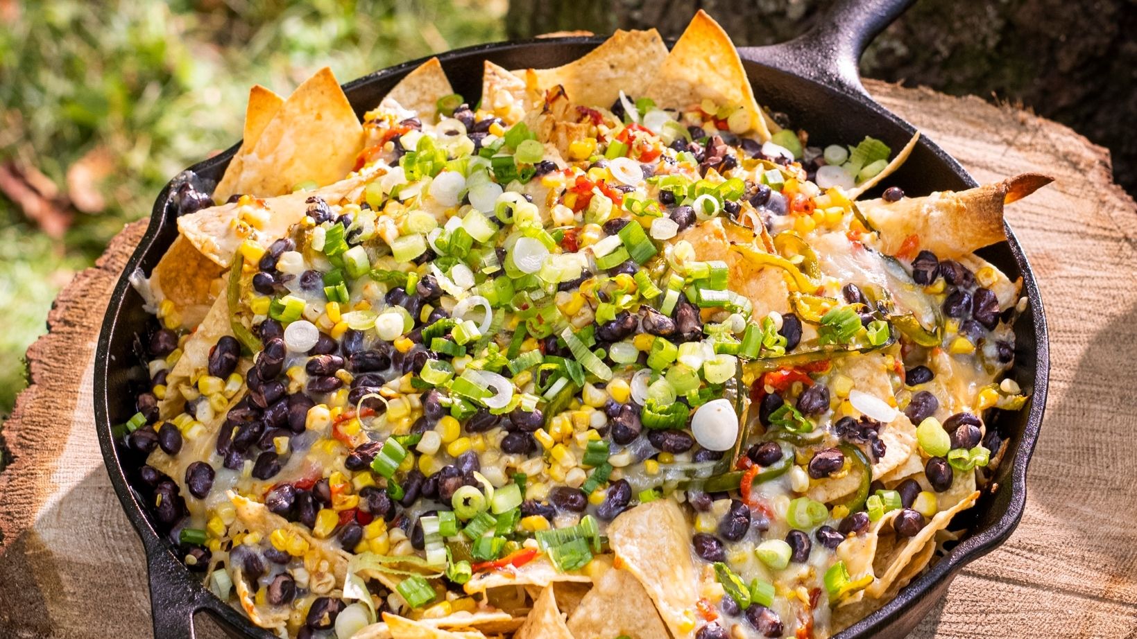 This cheesy, smoky plate of nachos will brighten up any cookout