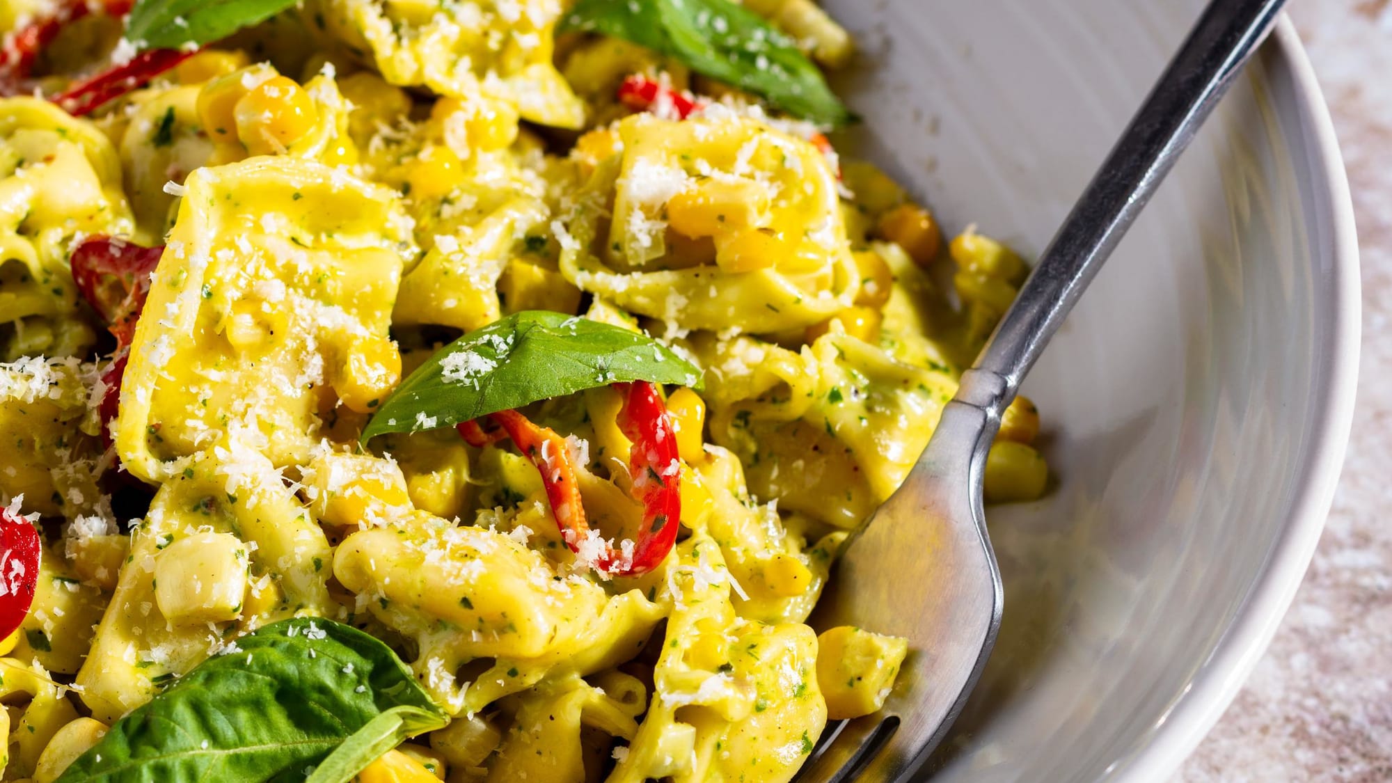 Fresh corn and basil add summery notes to this easy pasta dinner