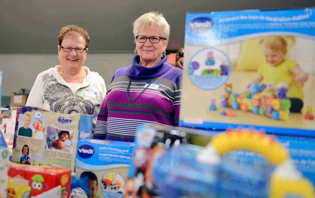 
                     Phyliss Dosman and Linda McNabb lend a hand earlier this week as Woolwich Community Services prepares hampers for its Christm
                     