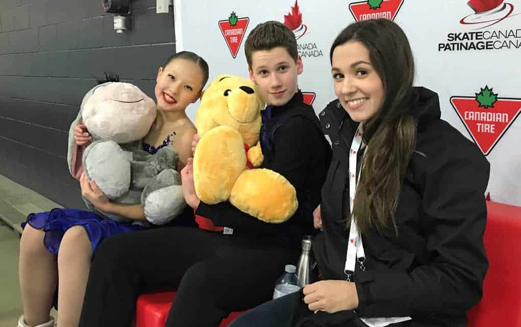 
                     Sophia Kagolovskaya and Kieran MacDonald are joined by their coach Carleigh MacDonald at the competition last month that wrap
                     
